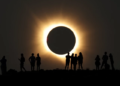 Millions witness total and partial solar eclipse as daytime darkness sweeps across parts of the world