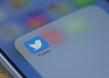 The Twitter logo is seen on a phone in this photo illustration in Washington, DC, on July 10, 2019. - Twitter is moving to filter out inappropriate content based on religion as part of its effort to curb hate speech. In a policy update on July 9, 2019, Twitter said it would take down "dehumanizing language" that targets specific religious groups.Examples shown by Twitter that would be removed would be description of a members of a religion as "disgusting" or "filthy animals." (Photo by Alastair Pike / AFP)        (Photo credit should read ALASTAIR PIKE/AFP/Getty Images)